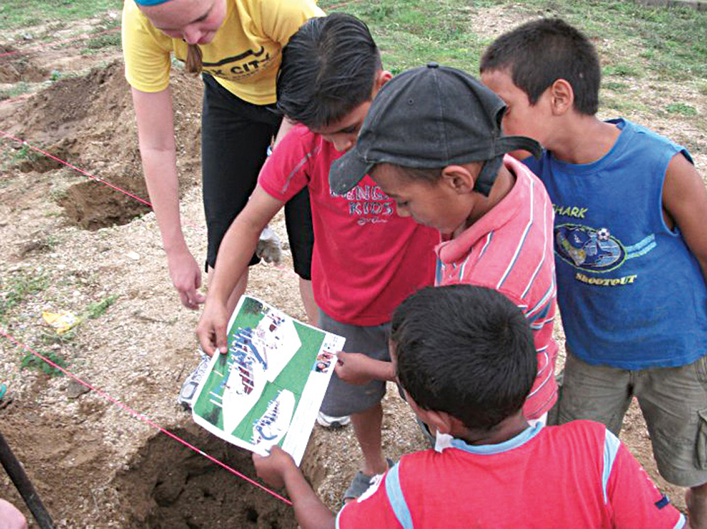 Children looking at playground designs