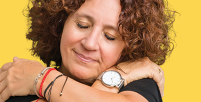 Woman hugging herself