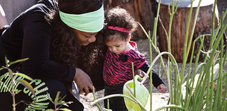 Teacher with child in desert garden