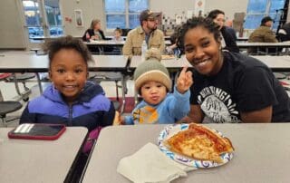 Parent having school lunch with children