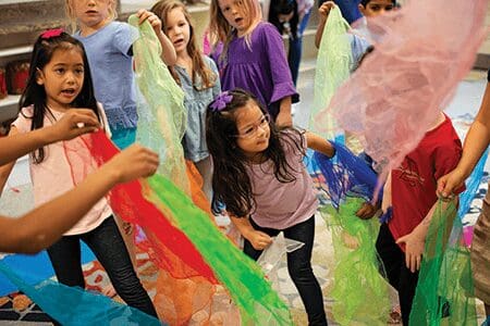 Children enjoying music through movement.