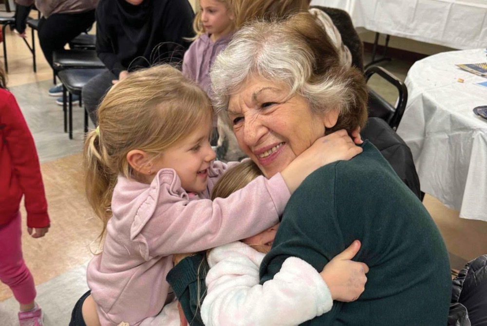 Woman and children hugging