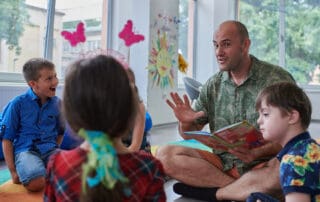 Educator reads a book to children