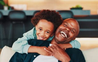 Child and educator happily embrace