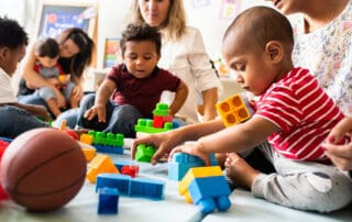 Children playing with blocks in a classroom