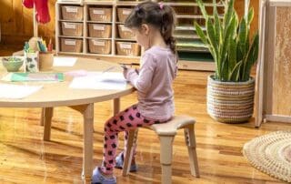Young child sitting at table
