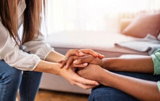 hands embracing in show of support