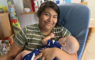 Caregiver holding an infant