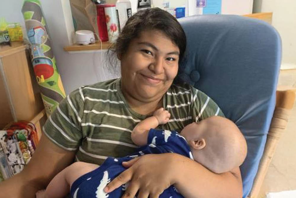 Caregiver holding an infant