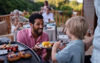 Adult and child at a school cookout